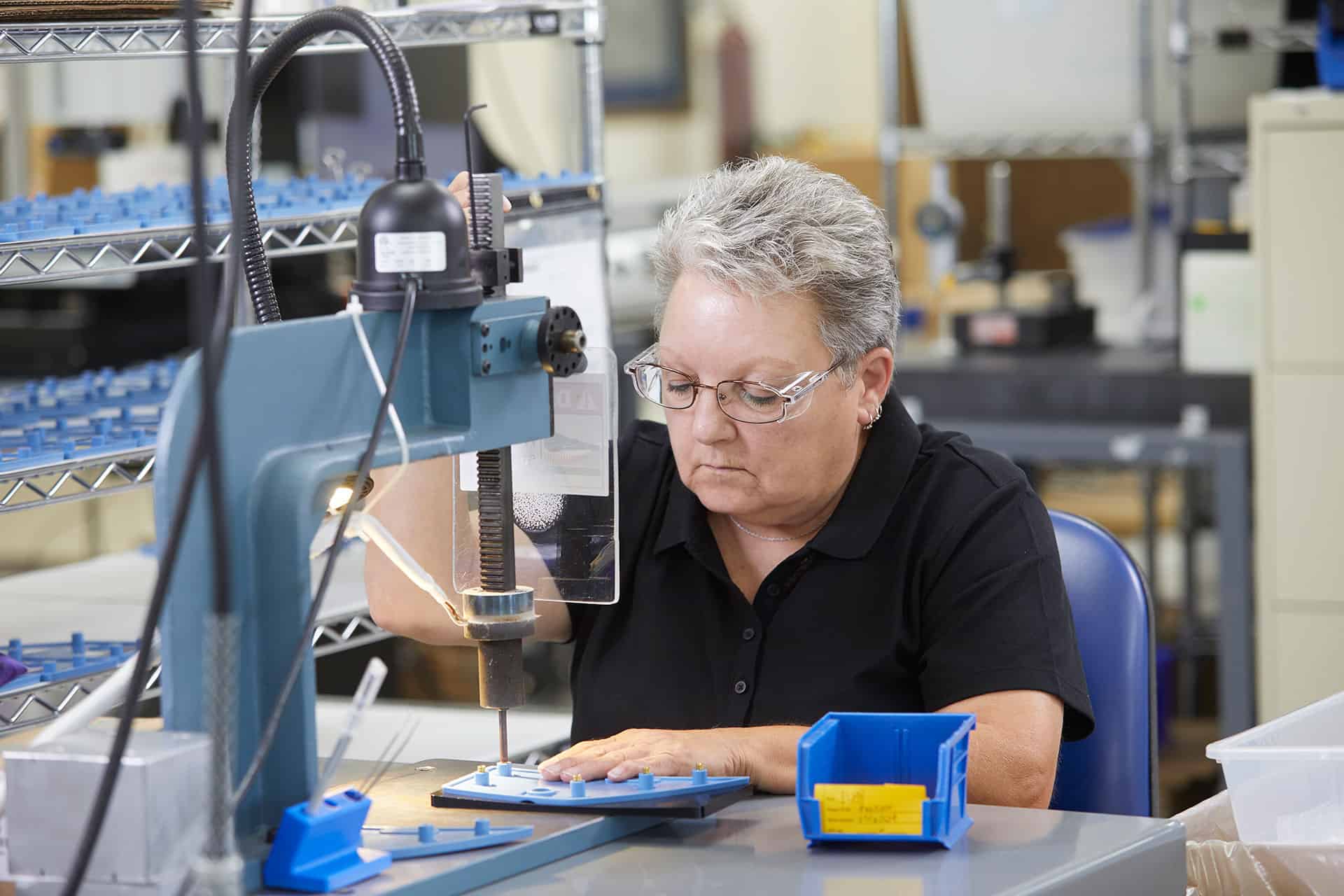 A woman operating machinery.
