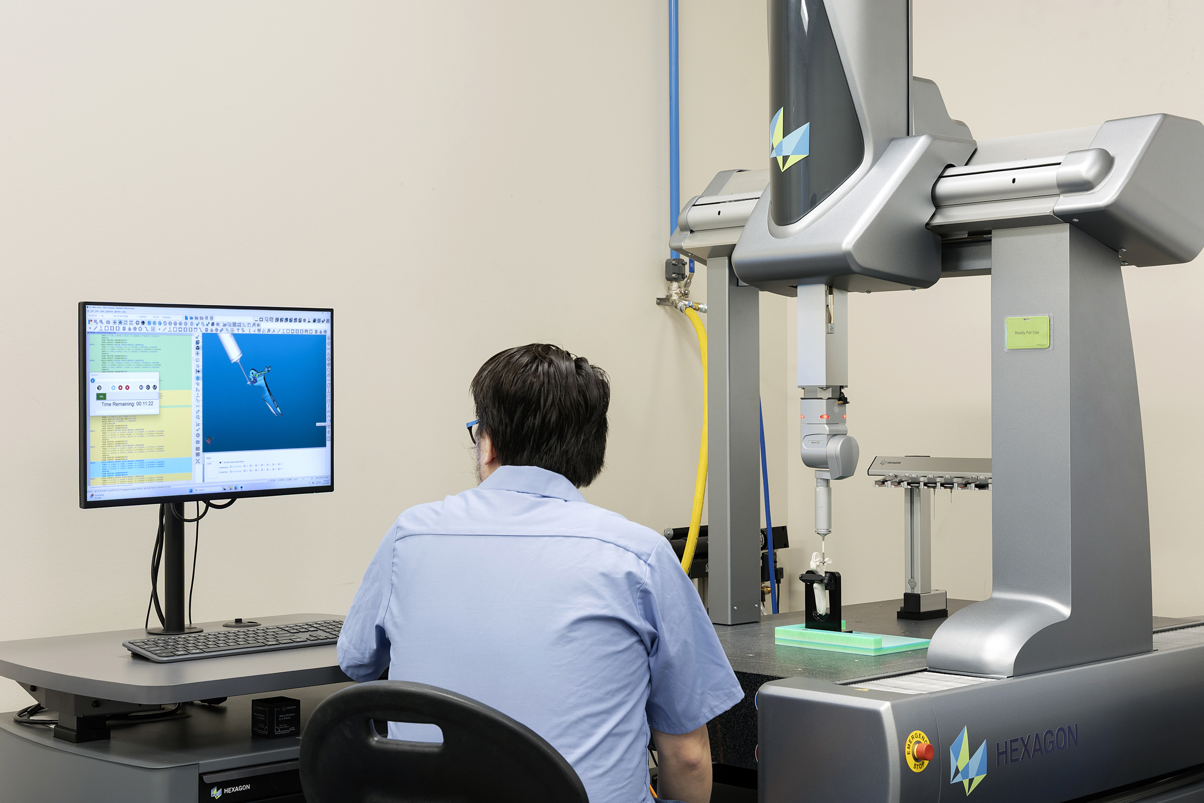 A Velosity employee works in on a machine in the Velosity Lab