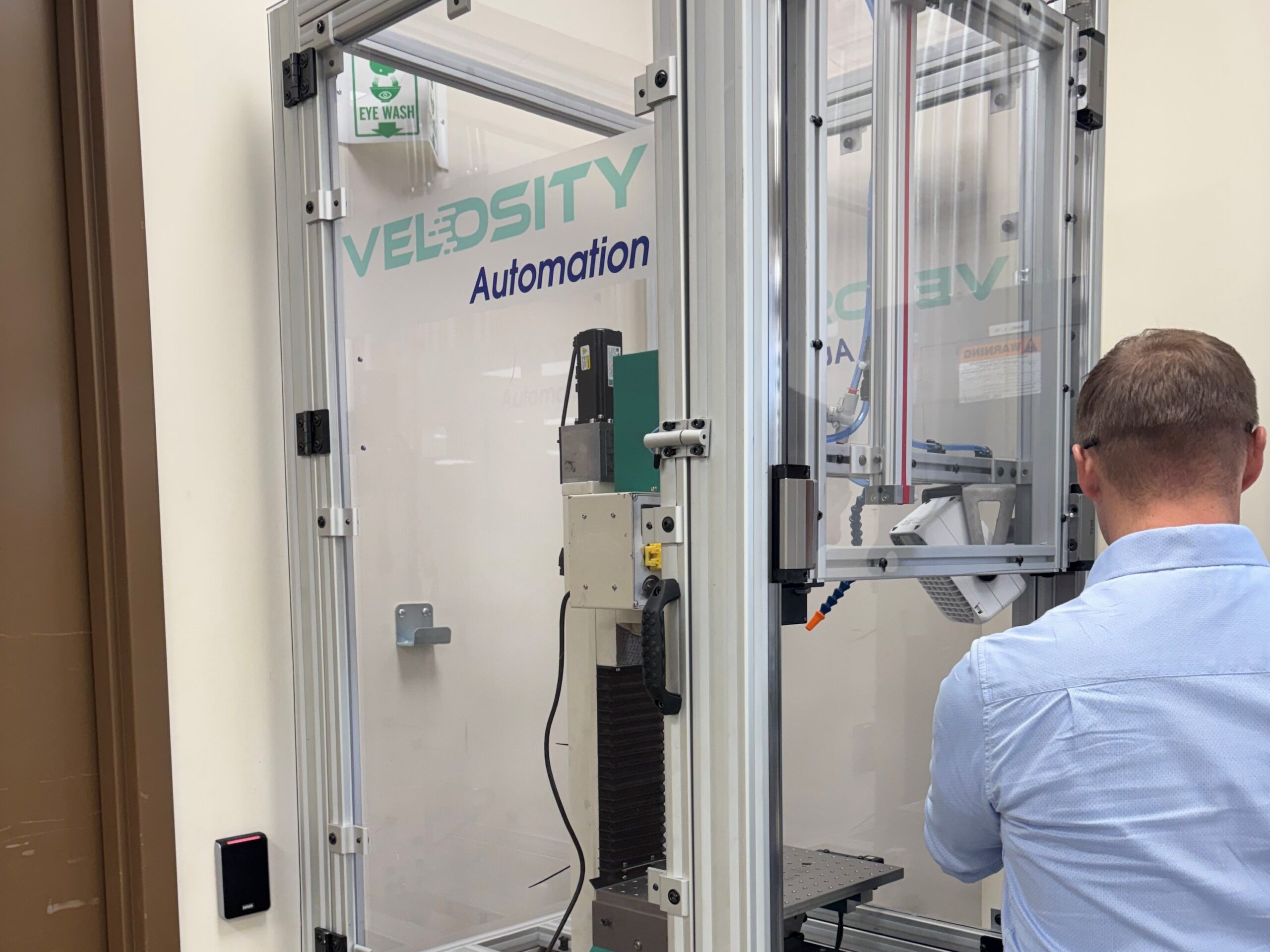 Embedded_Engineering_Product_Optimization_4x3 Velosity employees gather to look at plans